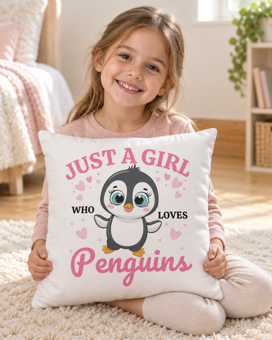 Girl holding a Just a Girl Who Loves Penguins cushion while sitting on a cream bedroom rug
