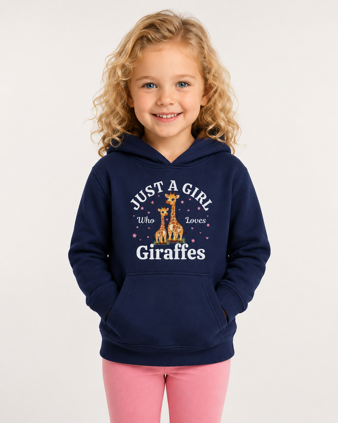 Little girl wearing a navy hoodie with a cute giraffe design and 'Just a girl who loves giraffes" text in a studio setting