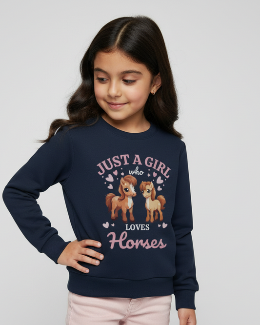 Girl wearing a navy blue sweatshirt with horse design and text on a light gray background