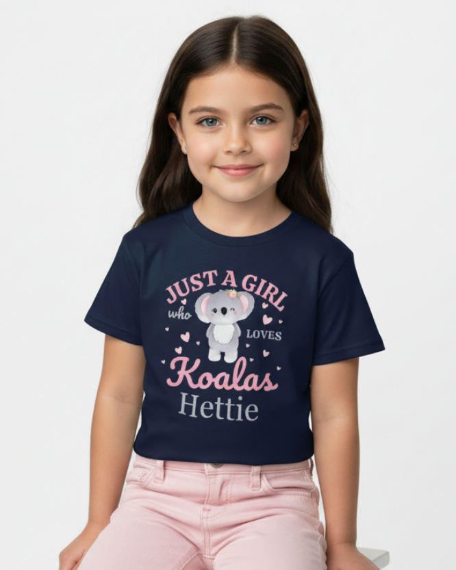 Girl wearing personalised “Just a Girl Who Loves Koalas” navy t-shirt with custom name, kids koala graphic tee UK