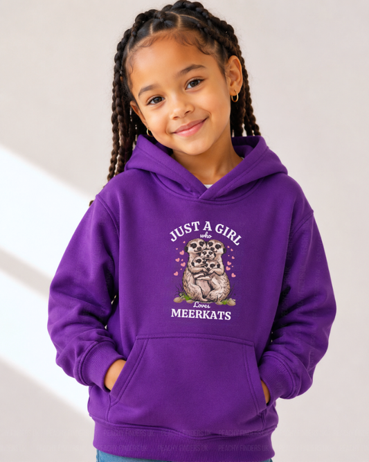Girl wearing a purple “Just a Girl Who Loves Meerkats” kids hoodie, shown in a  studio setting