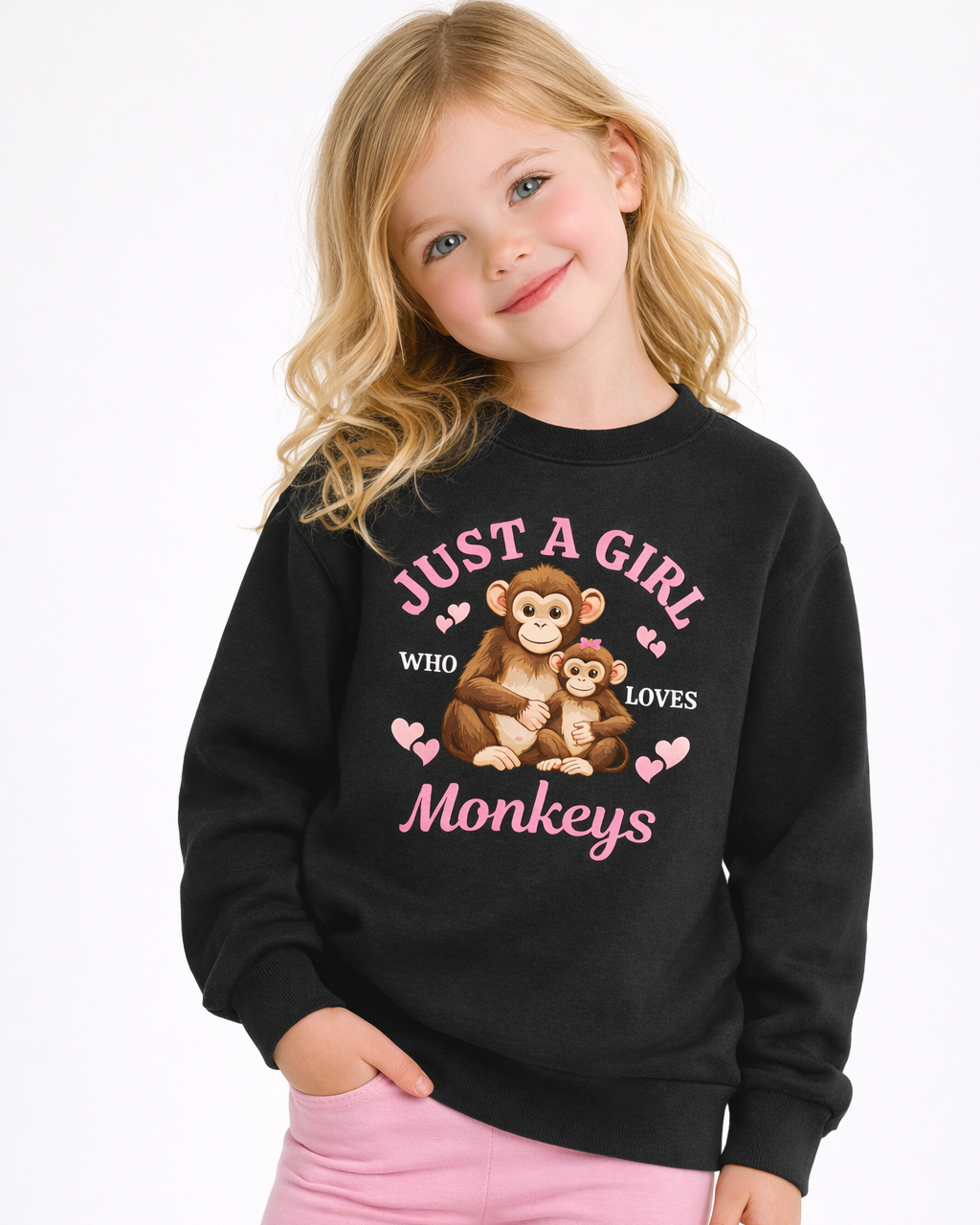 Blonde girl wearing black “Just a Girl Who Loves Monkeys” kids graphic sweatshirt with pink leggings – studio kids apparel photo