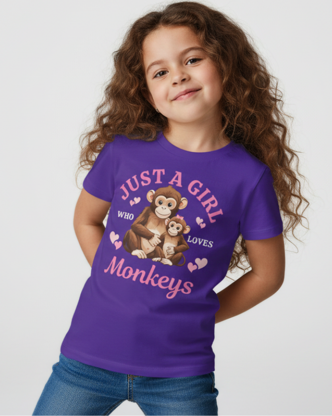 Girl wearing purple "Just a Girl Who Loves Monkeys" t-shirt with cute monkey graphic, studio background, kids cotton graphic tee.