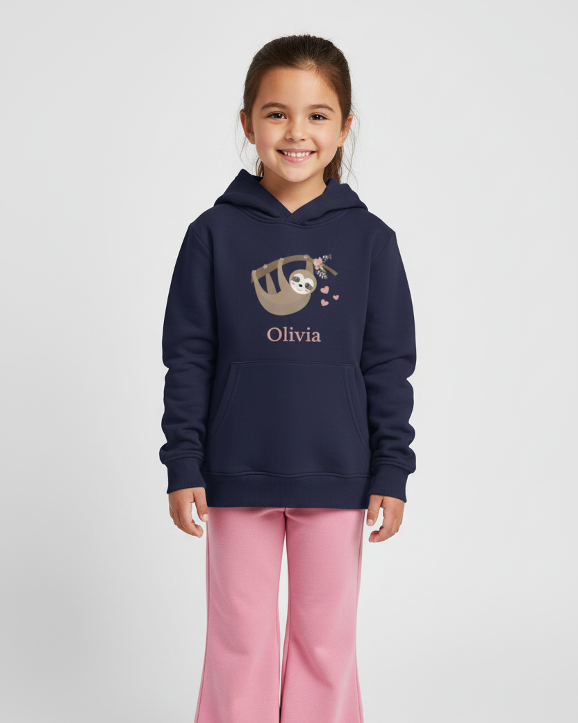 Young girl modelling a navy custom name hoodie featuring a sweet sloth illustration and the name Olivia, full length view on a light studio background
