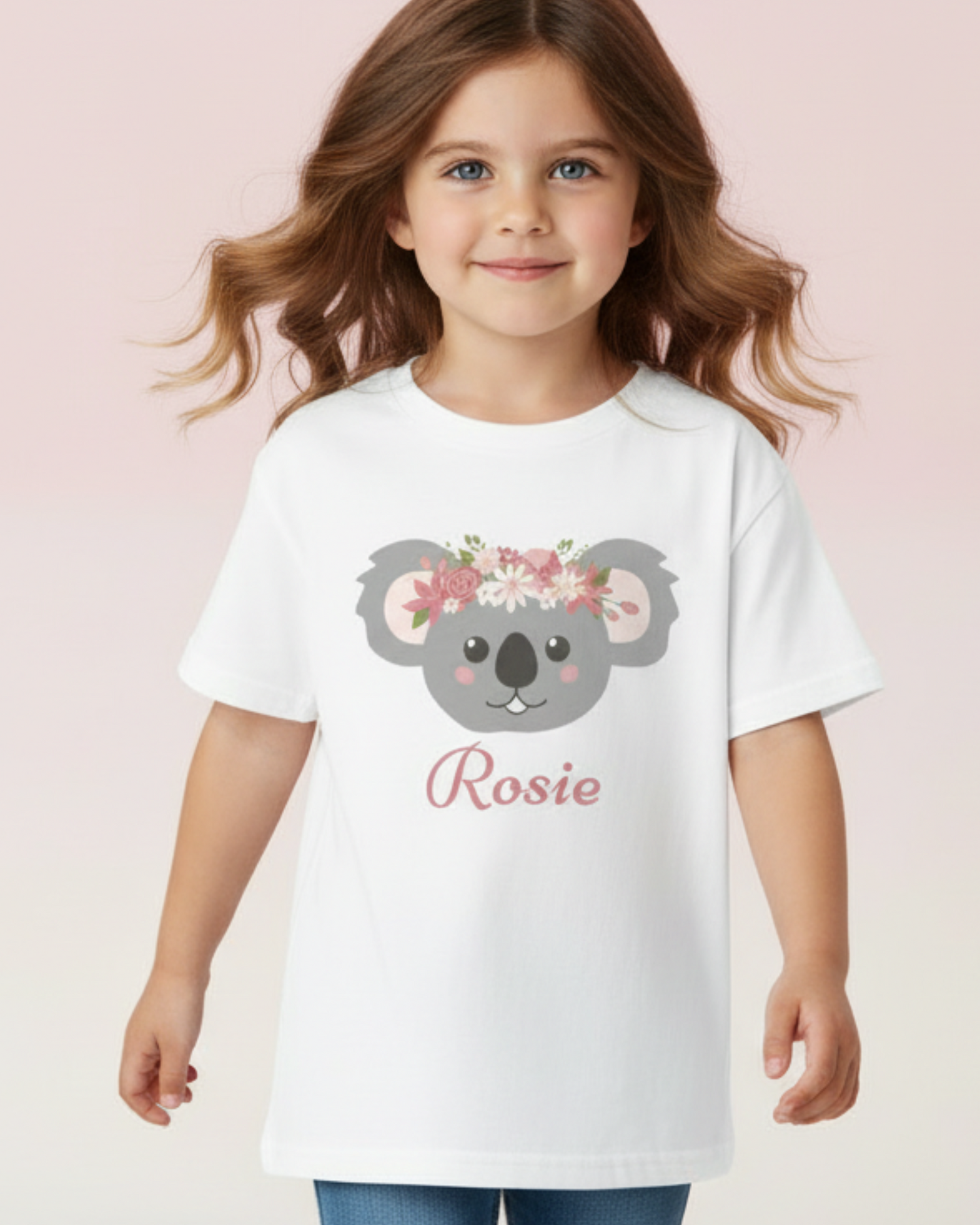 Child model wearing personalised koala t-shirt for girls with floral crown design and custom name Rosie on white cotton shirt