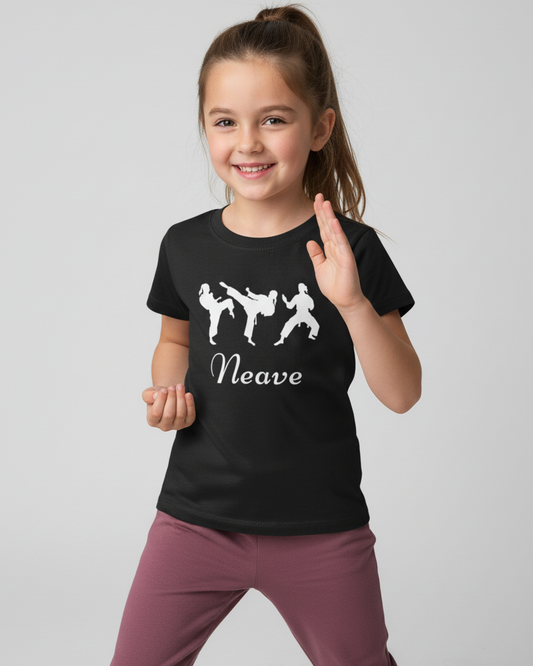 Smiling girl wearing personalised kids black martial arts t-shirt with name Neave in karate stance