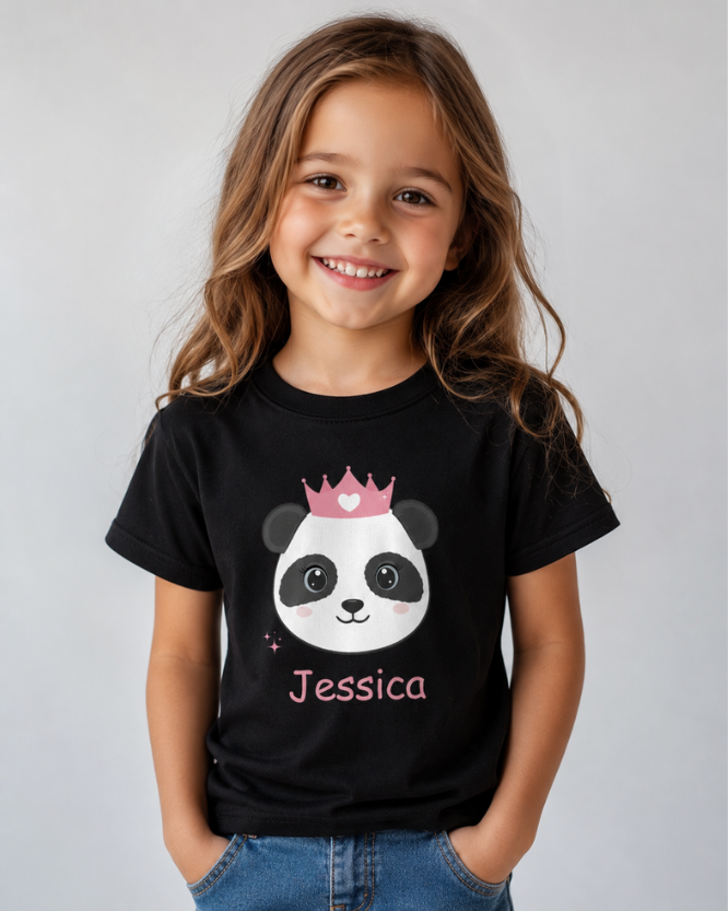 Smiling young girl wearing a black personalised panda princess t-shirt with pink crown and custom name