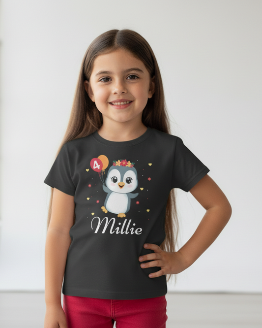 Personalised girls black birthday penguin t-shirt with age balloon and name Millie studio portrait
