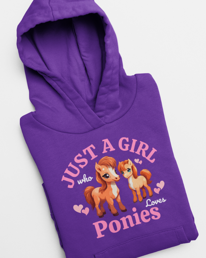 Folded purple kids hoodie with “Just a Girl Who Loves Ponies” graphic, close-up of print and fabric texture.