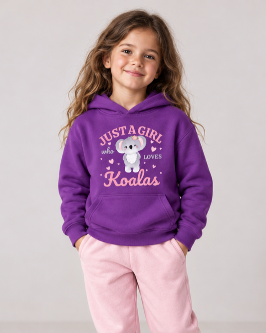 7-year-old girl wearing a purple Just a Girl Who Loves Koalas hoodie with light-pink joggers.