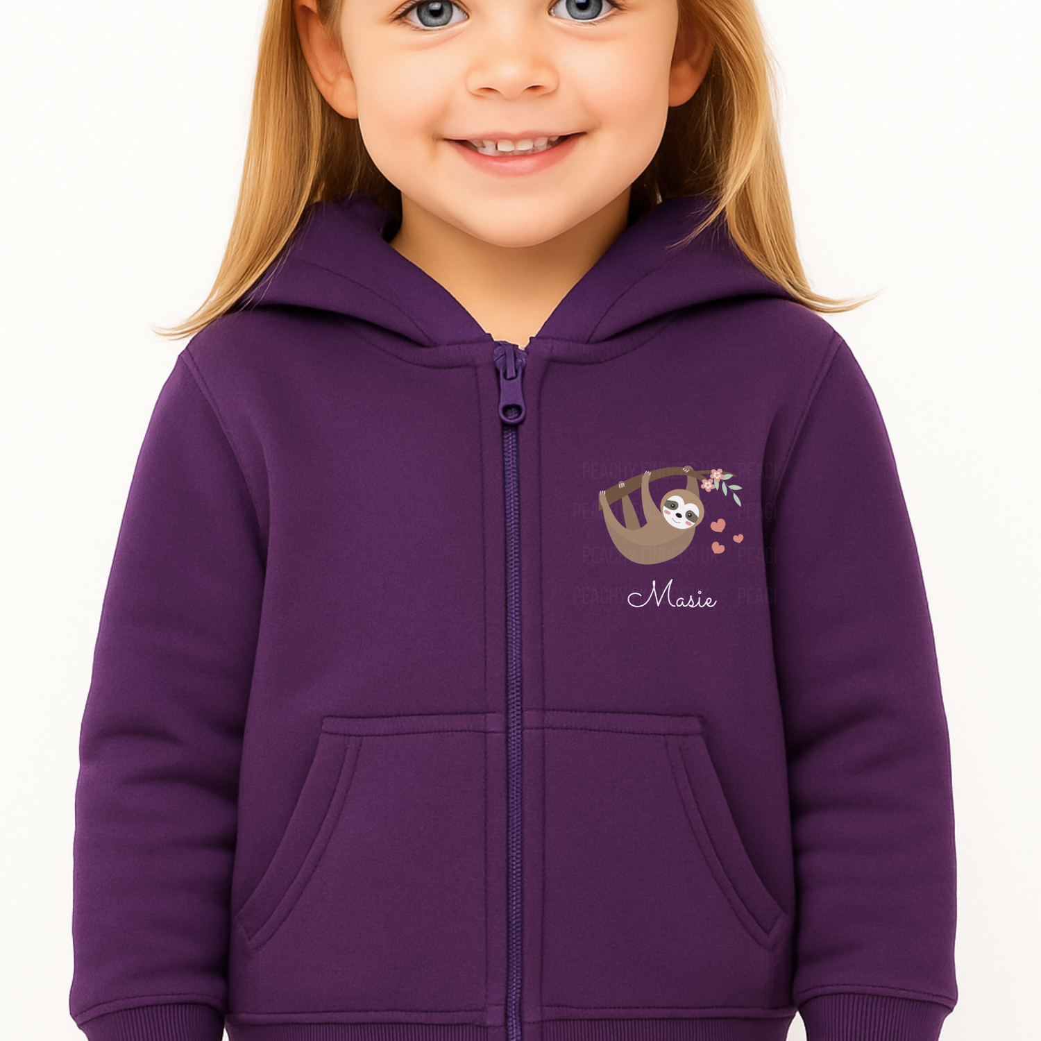 Little girl modelling a purple zip-up hoodie with hanging sloth, floral branch, pink hearts, and personalised name printed on the chest.