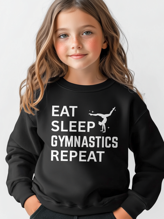 Girl wearing black kids gymnastics sweatshirt with Eat Sleep Gymnastics Repeat slogan