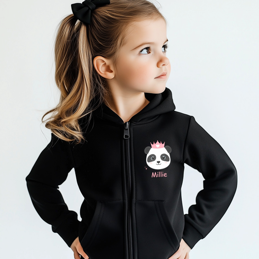Young girl wearing a black personalised zip hoodie with a panda princess design and custom name, featuring a cute crowned panda on the chest.
