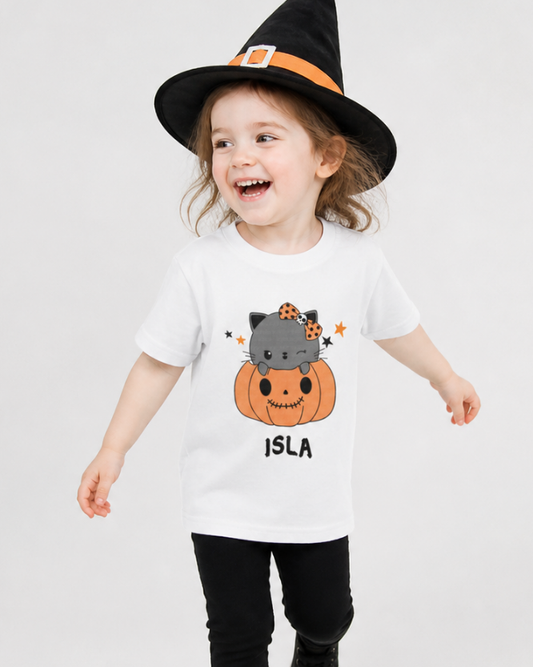 Personalised girls Halloween t-shirt with pumpkin cat design worn by child, custom name kids tee UK