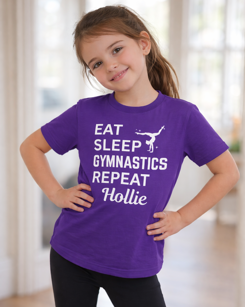 Child modelling purple custom name gymnastics t-shirt, Eat Sleep Gymnastics Repeat design, girls personalised sports top