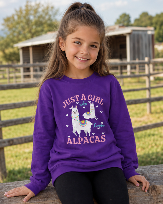 Girl wearing purple "Just A Girl Who Loves Alpacas" sweatshirt at countryside farm
