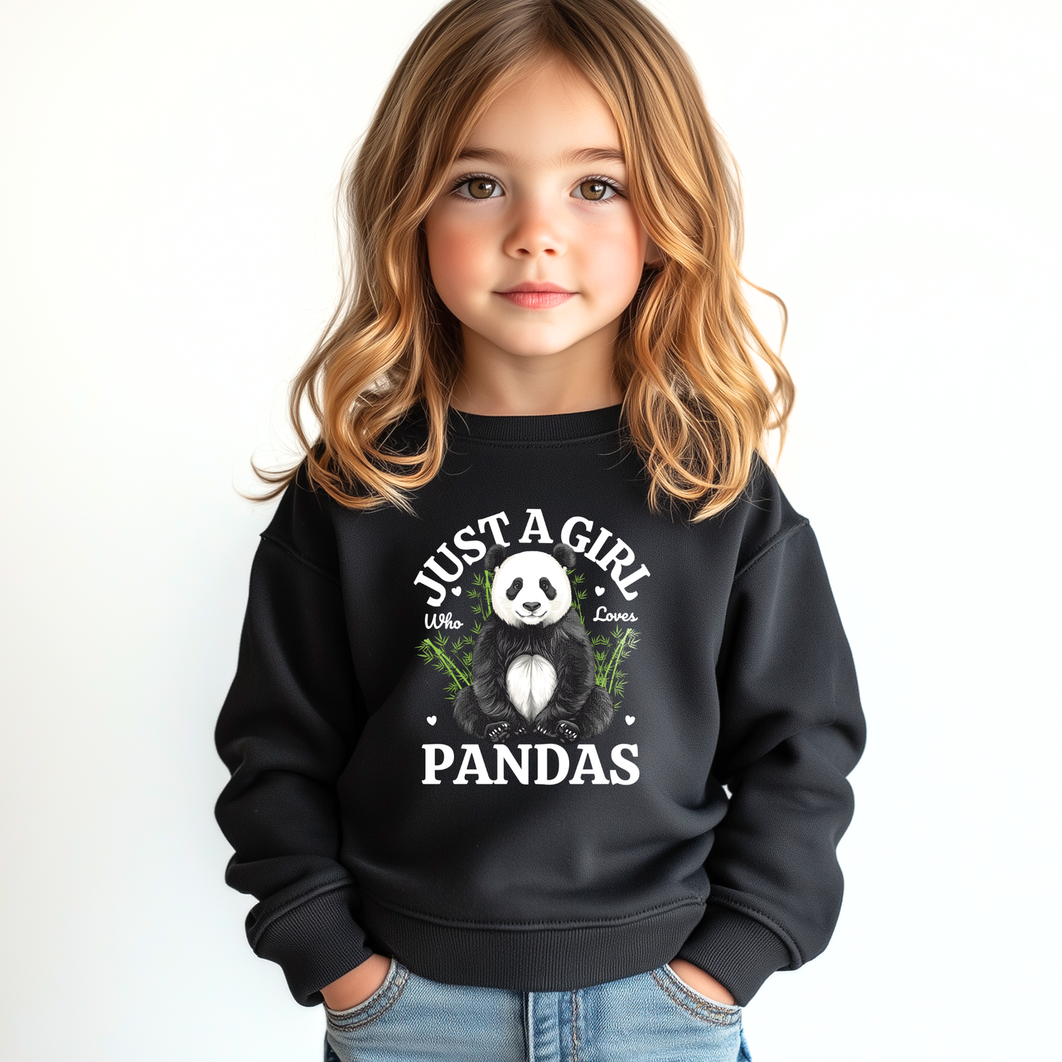 Young girl wearing a black sweatshirt featuring a "Just A Girl Who Loves Pandas" slogan with cute panda, little hearts and green bamboo printed graphic.