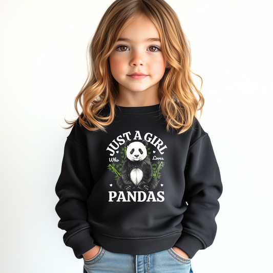 Young girl wearing a black sweatshirt featuring a "Just A Girl Who Loves Pandas" slogan with cute panda, little hearts and green bamboo printed graphic.