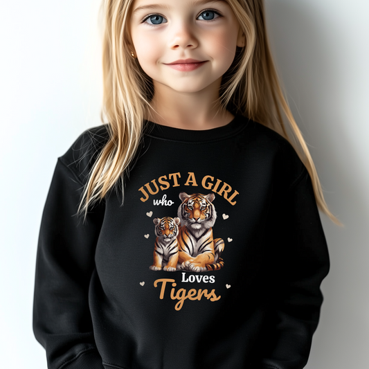 Young girl wearing a black sweatshirt featuring a “Just a Girl Who Loves Tigers” design with a mum and baby tiger illustration surrounded by hearts.