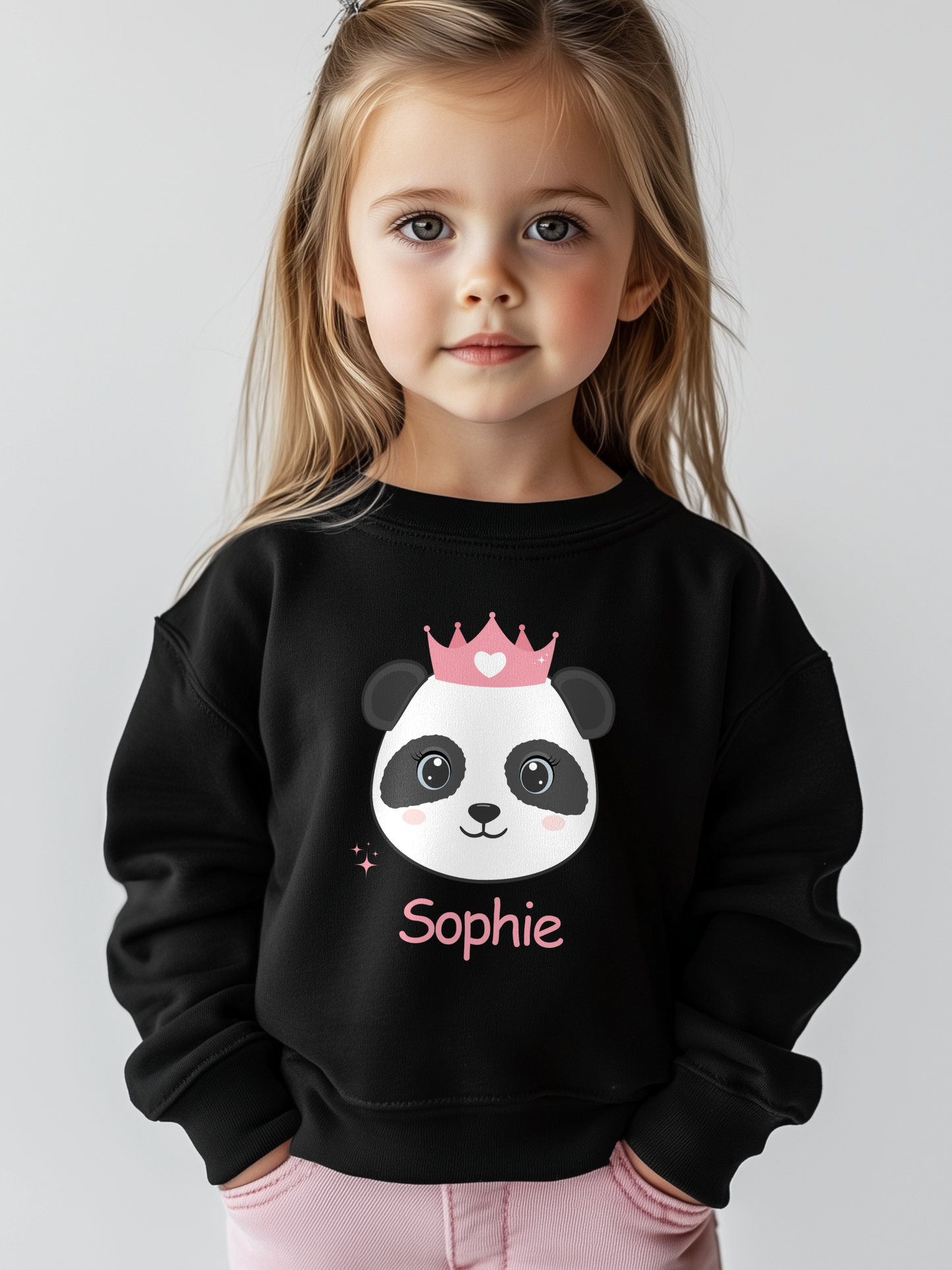 Girl wearing black personalised panda princess sweatshirt with custom name “Sophie”.