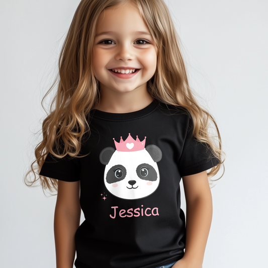 Smiling young girl wearing a black personalised panda princess t-shirt with pink crown and custom name