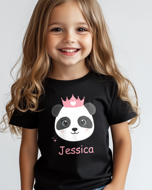 Smiling young girl wearing a black personalised panda princess t-shirt with pink crown and custom name