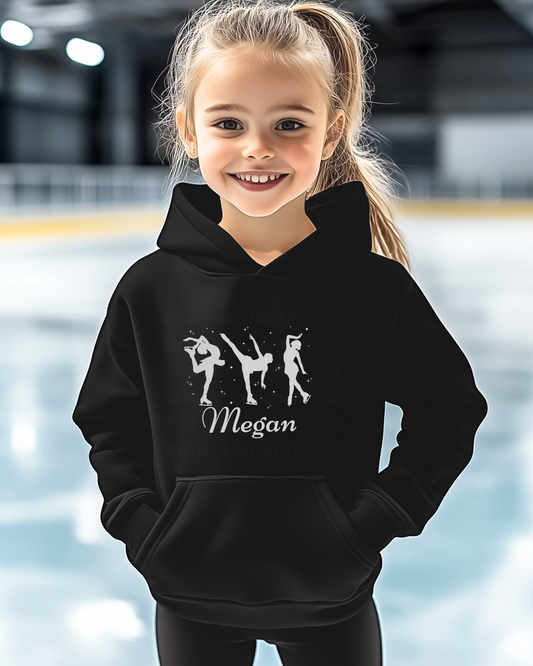 Young girl wearing a black hoodie with dance illustrations and the name 'Megan' at an indoor sports facility.