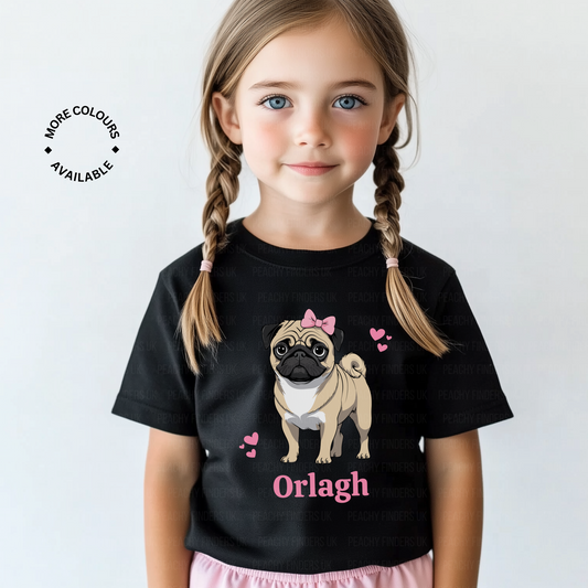 Child wearing a black t-shirt with a pug design and name 'Orlagh' on a white background
