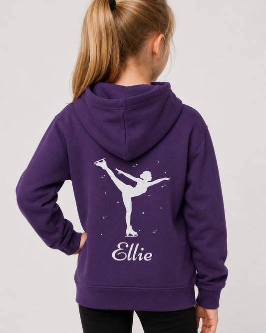 A child model shown from the back wearing a purple hoodie with a white graphic of a figure skater and the name 'Ellie' printed on the back, set against a plain light gray background.