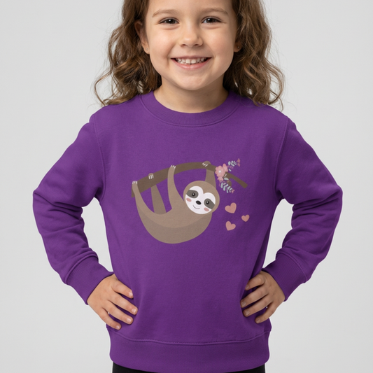 Little girl models a purple sweatshirt with a sloth design on a white background