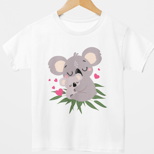 Girls white cotton t-shirt styled on a wooden hanger featuring a cute baby and mum koala embracing with scattered pink hearts and green eucalyptus leaves