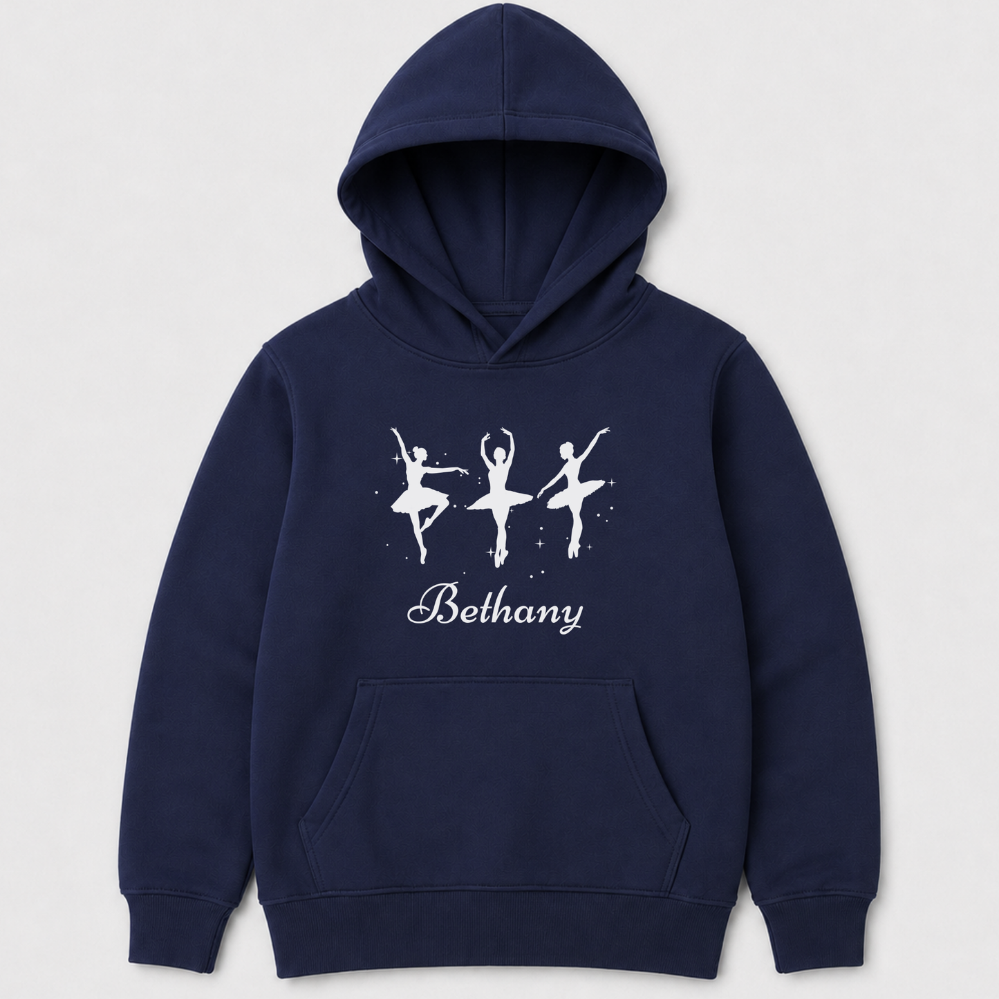 A navy blue kids pullover hoodie with a white graphic of three ballerina silhouettes and the name 'Bethany' printed on the chest - flat lay product