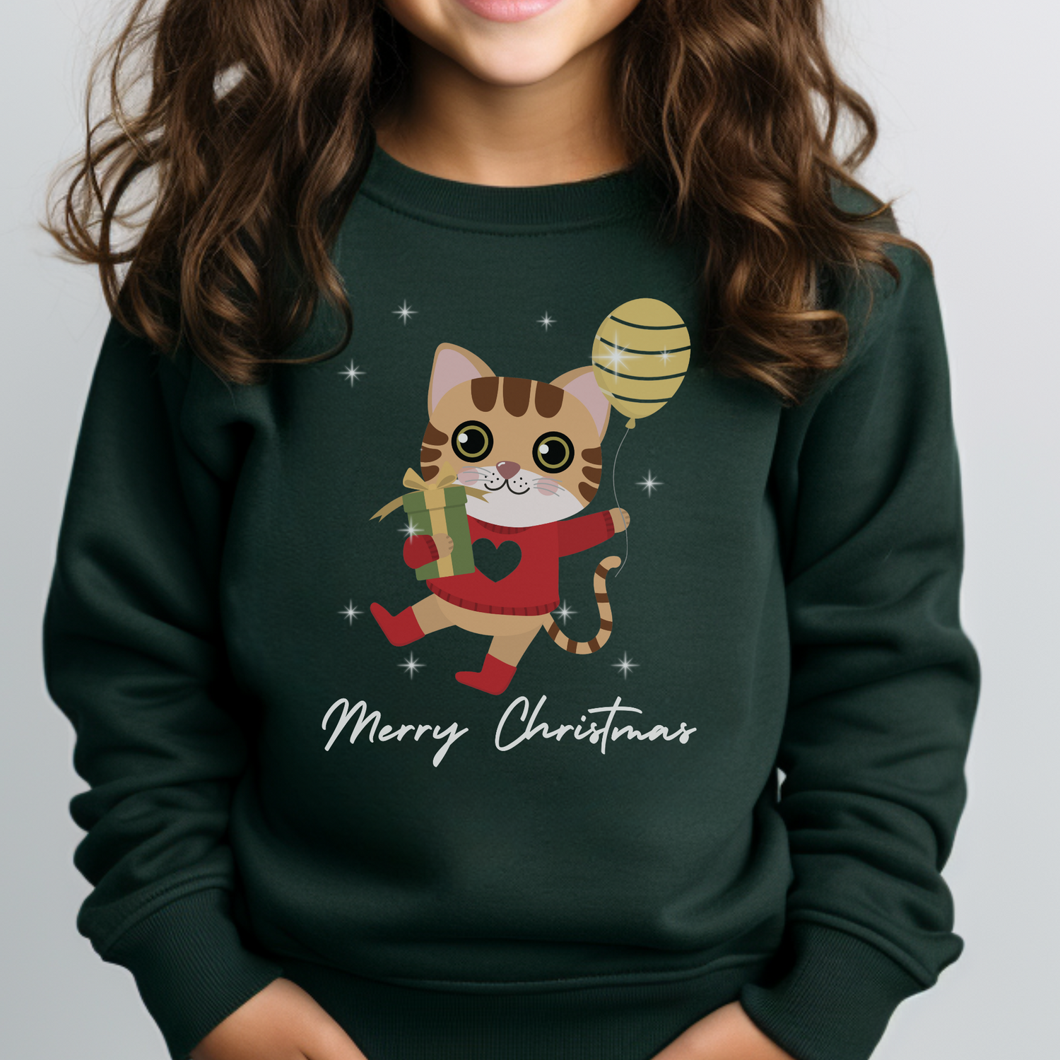 Dark green kids Christmas sweatshirt with a cute festive cat holding a present and balloon and “Merry Christmas” text on the front.