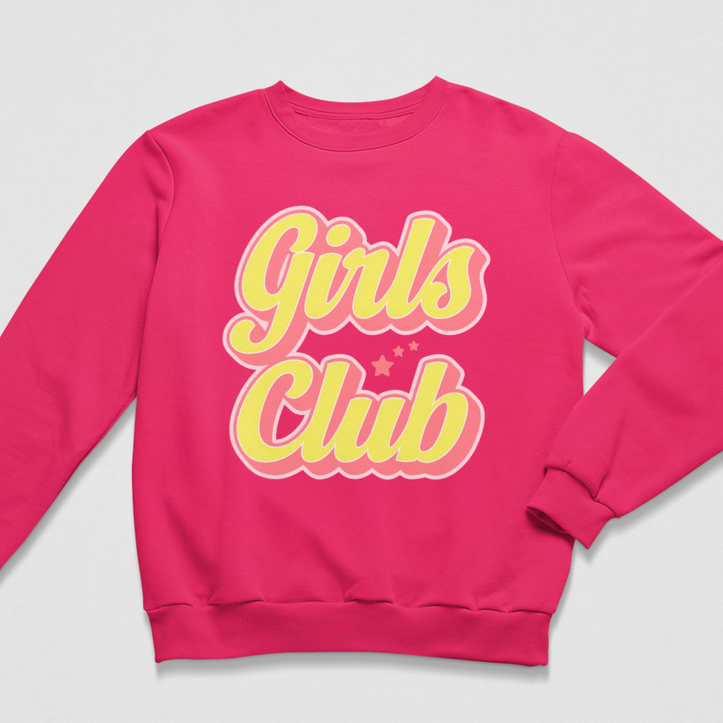A kids bright pink crewneck sweatshirt featuring a retro-style graphic on the chest that reads 'Girls Club' in yellow bubble letters with a pink outline, displayed on a light grey background.