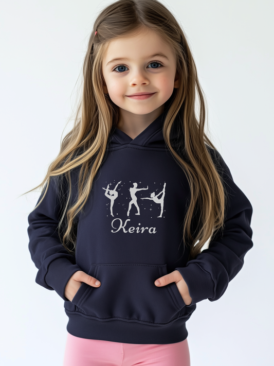 Girl wearing personalised navy gymnastics hoodie with name and gymnast silhouette print