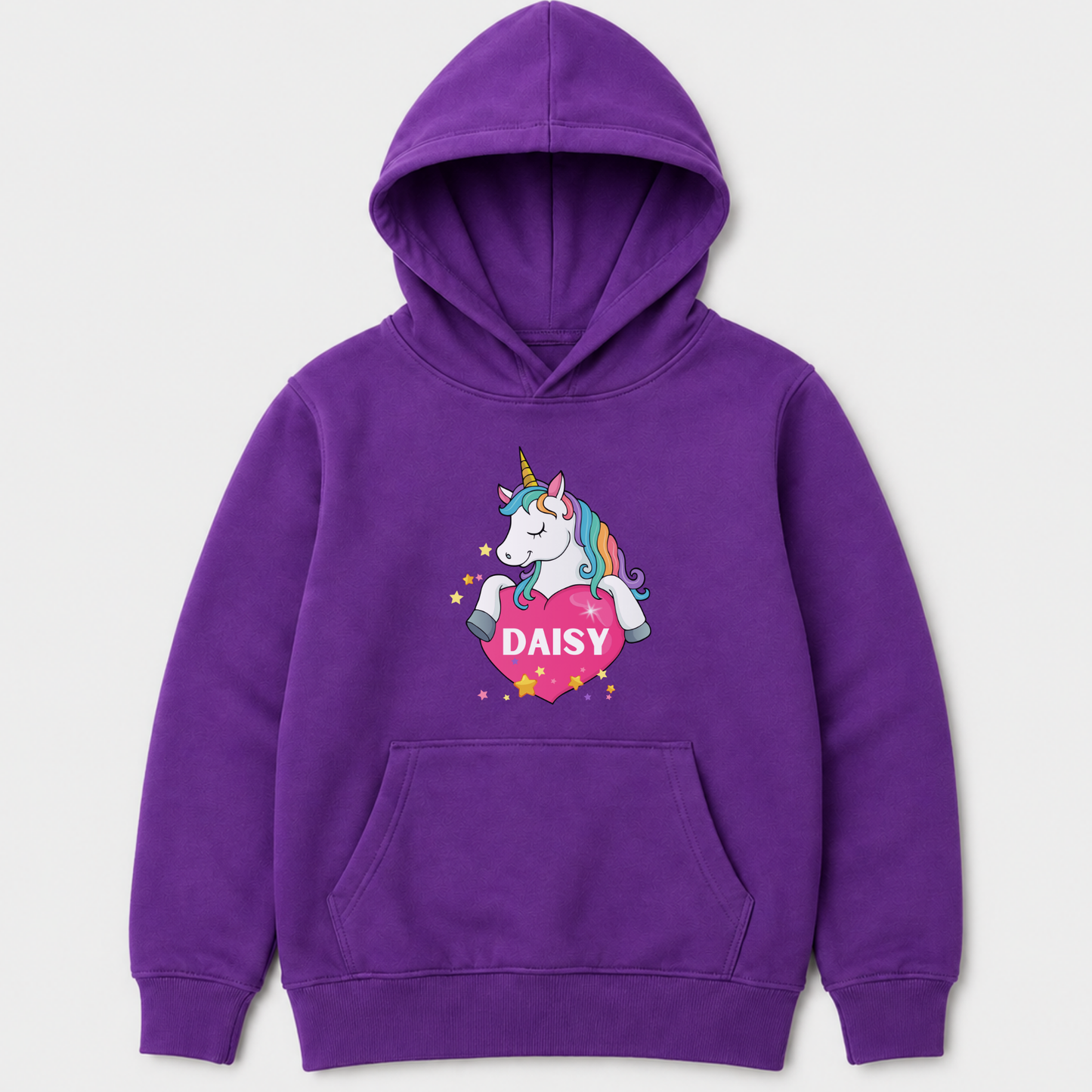 A purple kids pullover hoodie with a cartoon unicorn graphic on the chest. The graphic shows a white unicorn with a rainbow mane holding a pink heart that says 'DAISY' in white letters, surrounded by small yellow stars.