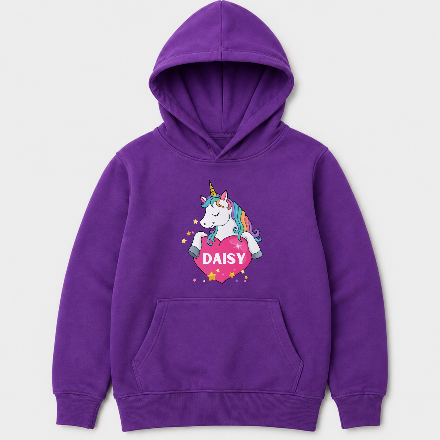 A purple kids pullover hoodie with a cartoon unicorn graphic on the chest. The graphic shows a white unicorn with a rainbow mane holding a pink heart that says 'DAISY' in white letters, surrounded by small yellow stars.
