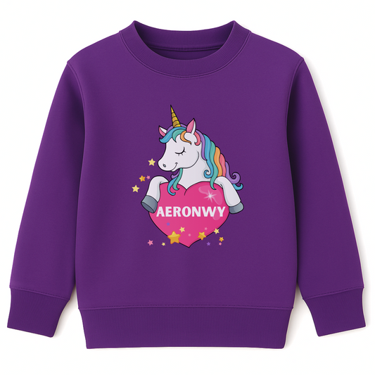 Purple kids sweatshirt featuring a colourful unicorn holding a pink heart with the custom name “Aeronwy” printed inside, surrounded by yellow and pink stars.
