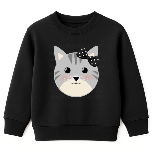 Girls black sweatshirt featuring a cute grey cat face with black polka-dot bow and blushing cheeks