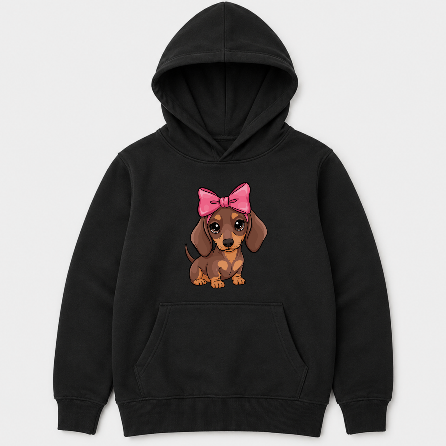 A kids black pullover hoodie featuring a cartoon graphic of a brown dachshund wearing a pink bow on the chest, displayed against a light grey background.