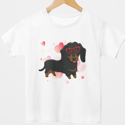 White t-shirt with a dachshund graphic and heart designs on a white background