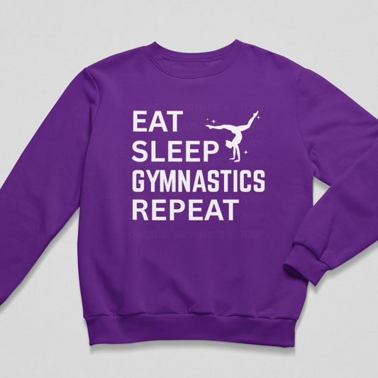 Purple kids gymnastics sweatshirt flat lay with Eat Sleep Gymnastics Repeat slogan