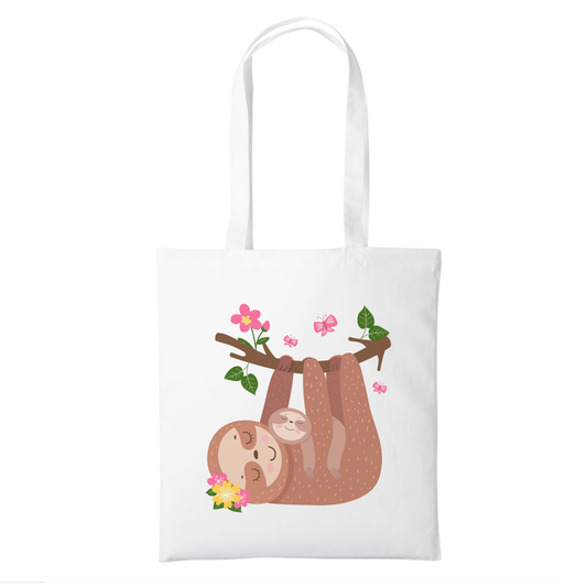 A kids white cotton tote bag with a printed illustration of a smiling sloth hanging from a branch with pink flowers, shown on a plain white background.