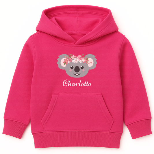 Hot pink girls personalised hoodie featuring a cute koala face wearing a floral crown with pink and white flowers, customised with the name.