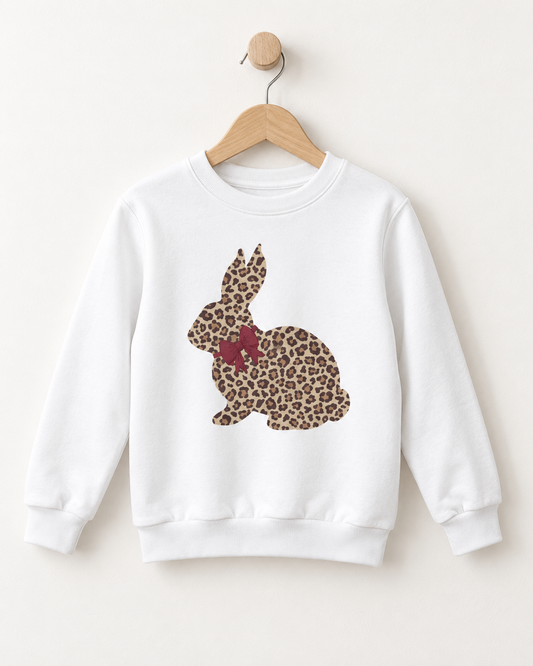 White girls’ sweatshirt featuring a leopard-print bunny with a burgundy bow, displayed on a wooden hanger.