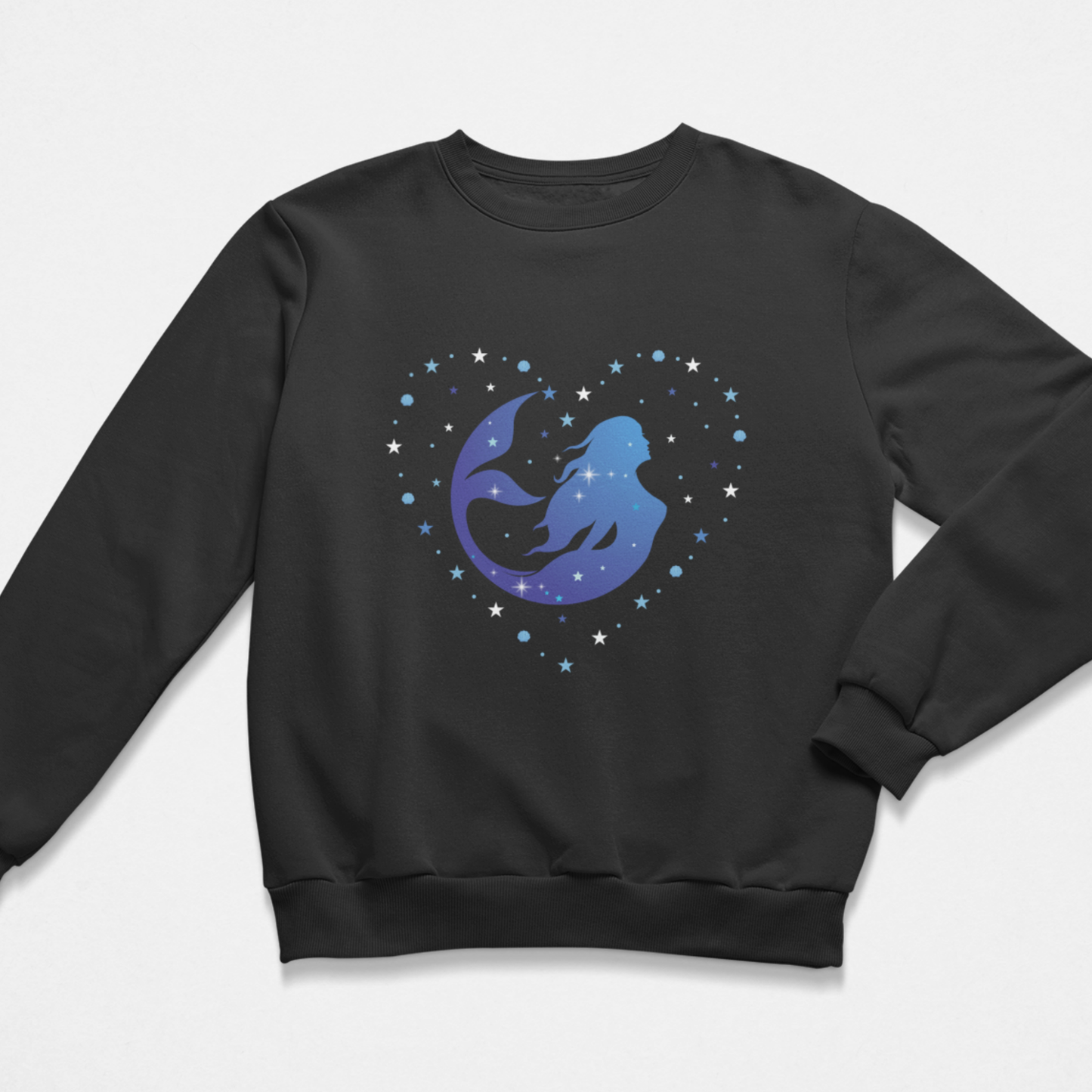 Girls black crewneck sweatshirt featuring a graphic of a blue and purple ombre mermaid silhouette swimming inside a heart formed with shells and stars 