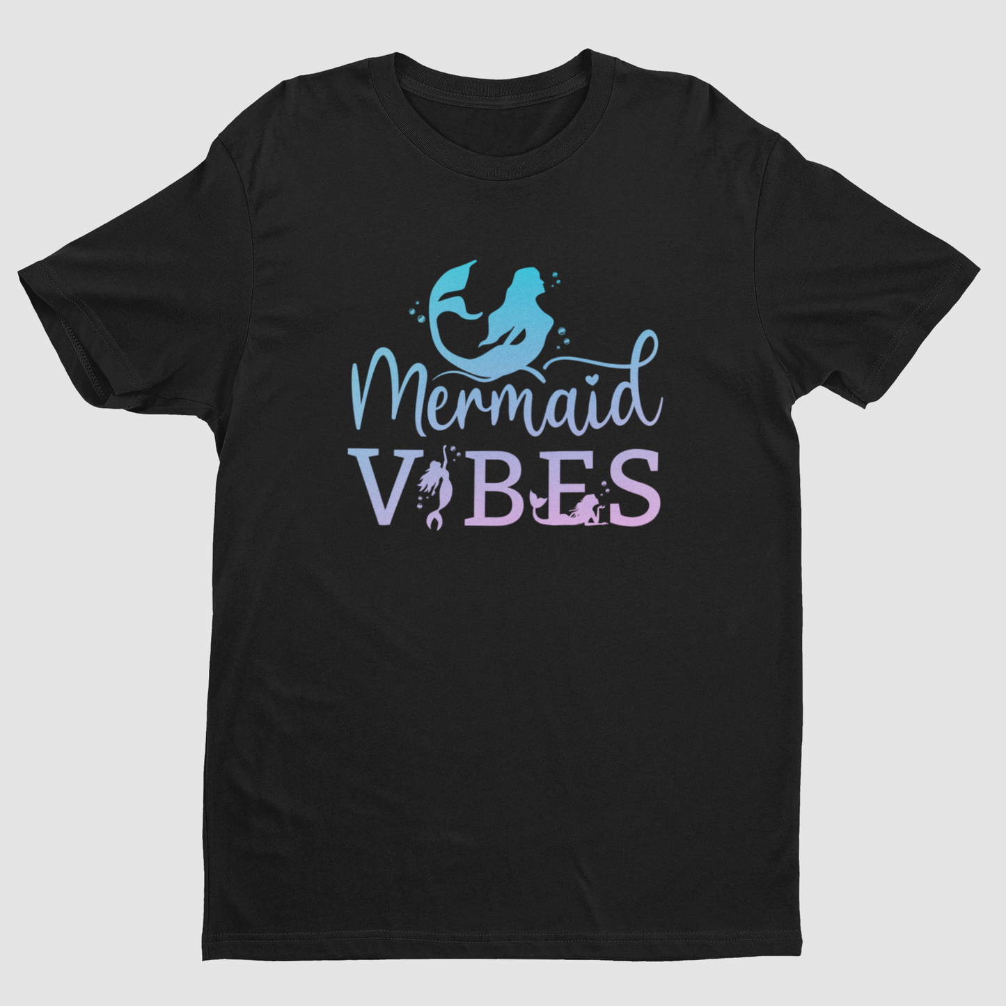 A black short-sleeve crewneck t-shirt featuring a 'Mermaid Vibes' graphic on the chest. The graphic includes a light blue mermaid silhouette and the words 'Mermaid VIBES' in a light blue and lavender-purple gradient font, set against a plain light gray background.