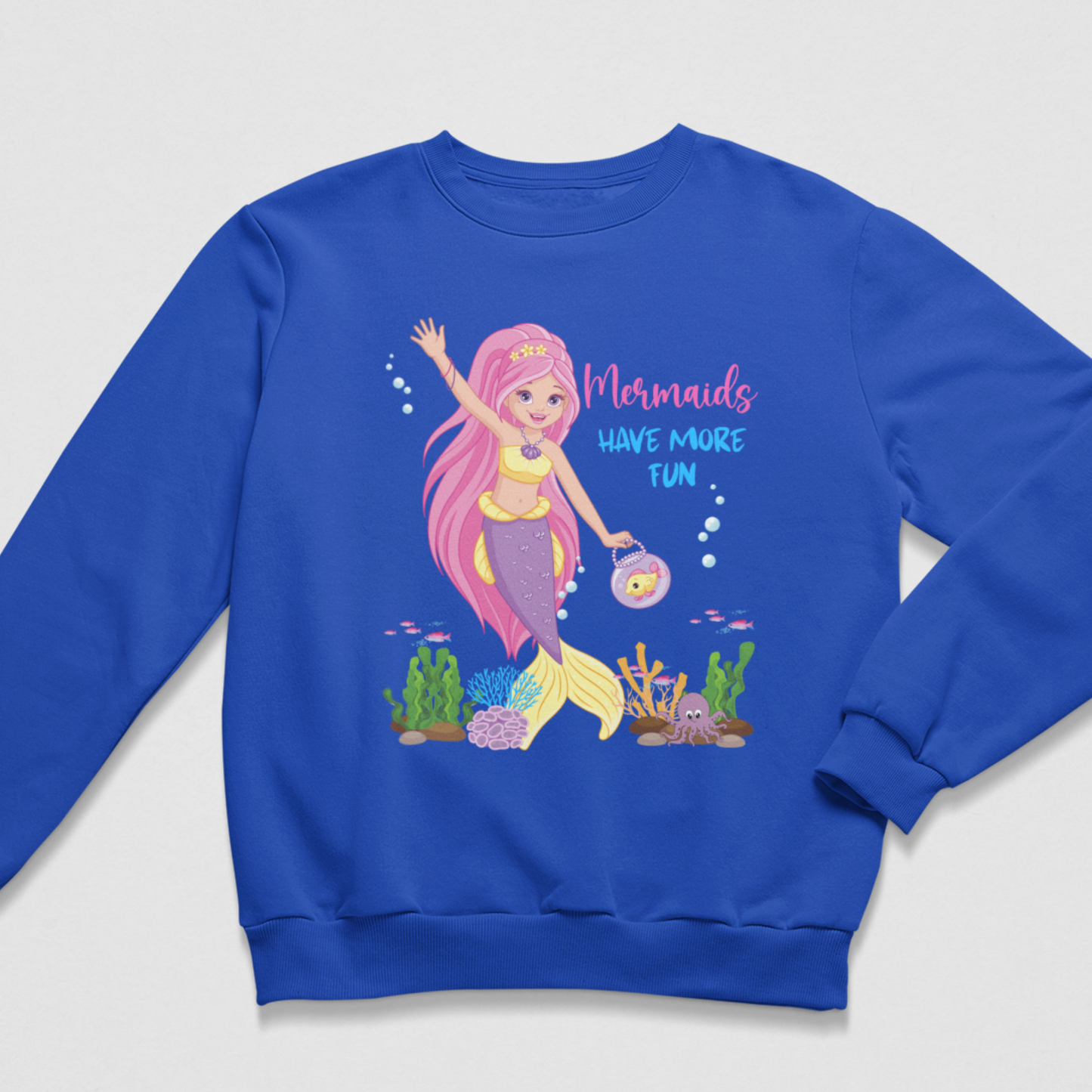 Girls’ royal-blue sweatshirt with a pink-haired mermaid, fishbowl handbag and colourful “Mermaids Have More Fun” design.