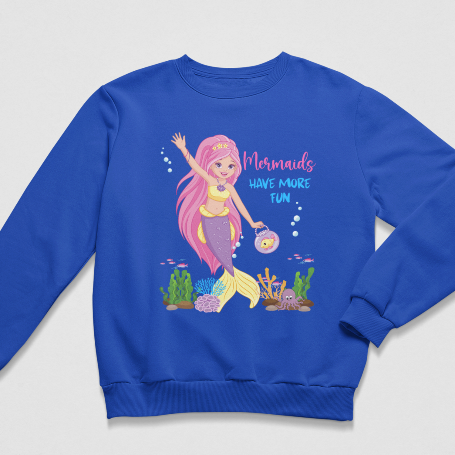 Girls’ royal-blue sweatshirt with a pink-haired mermaid, fishbowl handbag and colourful “Mermaids Have More Fun” design.