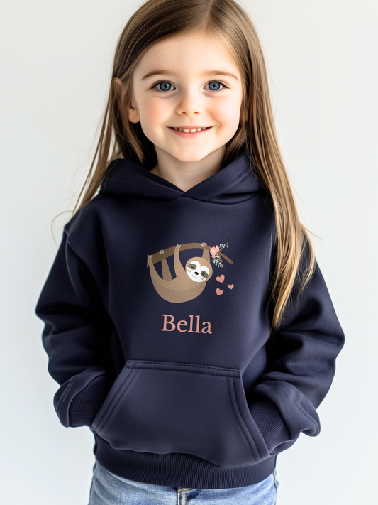 Young girl wearing a navy personalised sloth hoodie with cute hanging sloth design and custom name